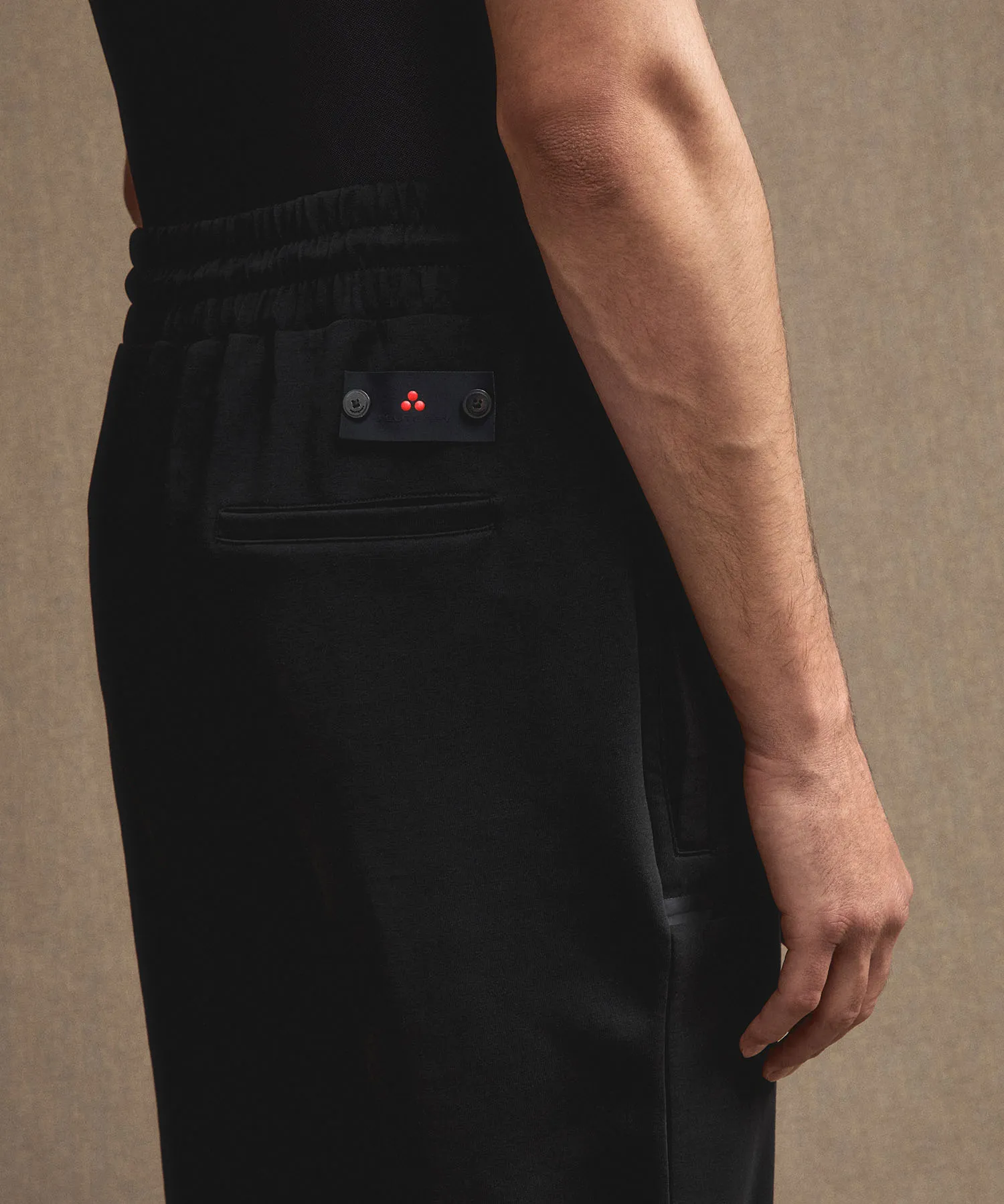 Pantaloni joggers in cotone stretch con nastrature